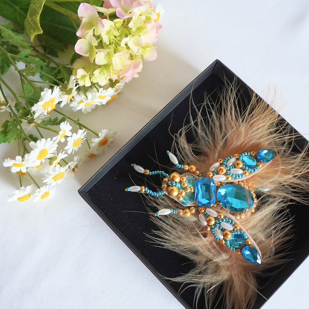 Handmade embroidered azure blue and gold insect brooch with feathers - TGbrooch