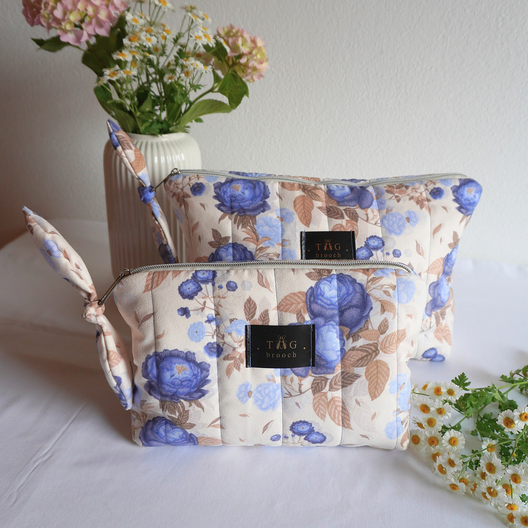 Two floral-patterned makeup bag with blue roses on beige background - TGbrooch