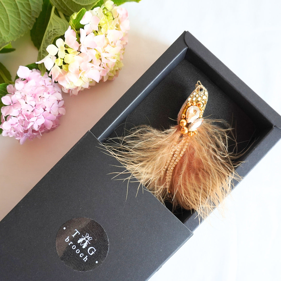Handmade embroidered beaded bird brooch with gold and champagne gemstones, beads and feathers in TGbrooch box