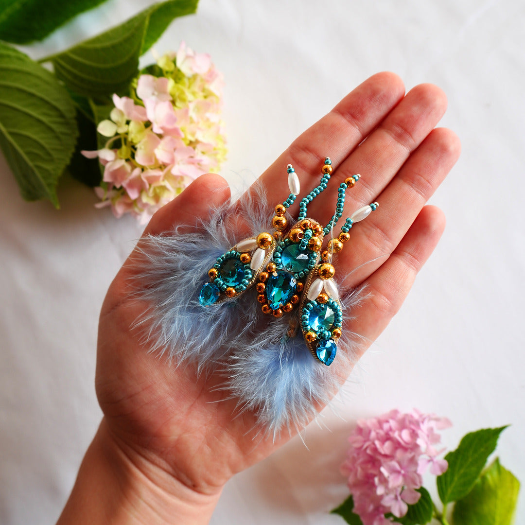 Handmade beaded fly brooch small size with azure blue and gold beads, gemstones and feathers - TGbrooch