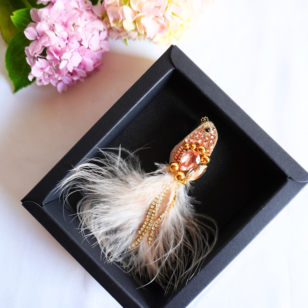 Decorative beaded bird brooch with feathers and beads in a black box - TGbrooch
