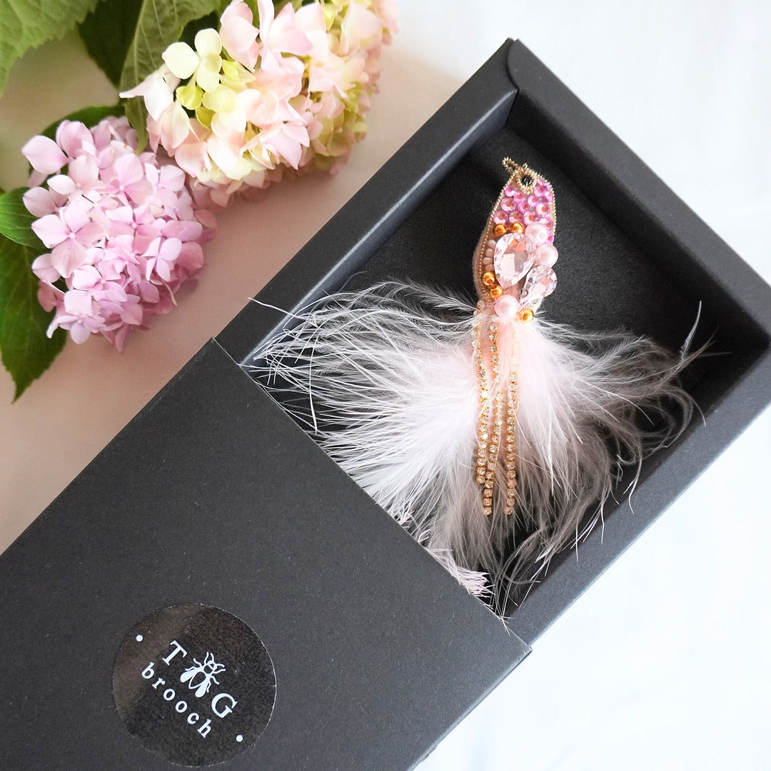 Handmade beaded bird brooch with rose pink and gold beads, gemstones and feathers in TGbrooch box