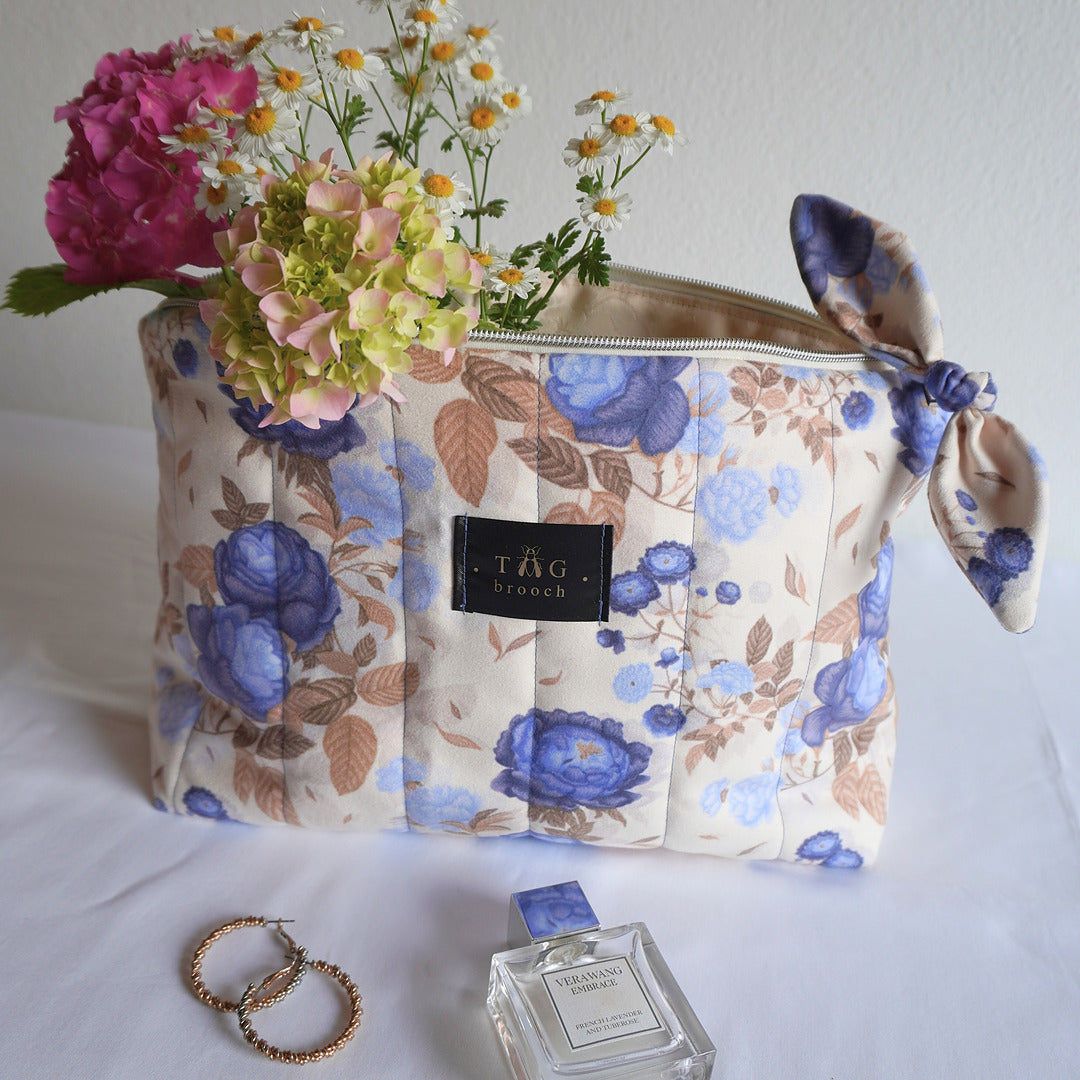 Medium size handmade floral-patterned pouch with a bow and TGbrooch tag