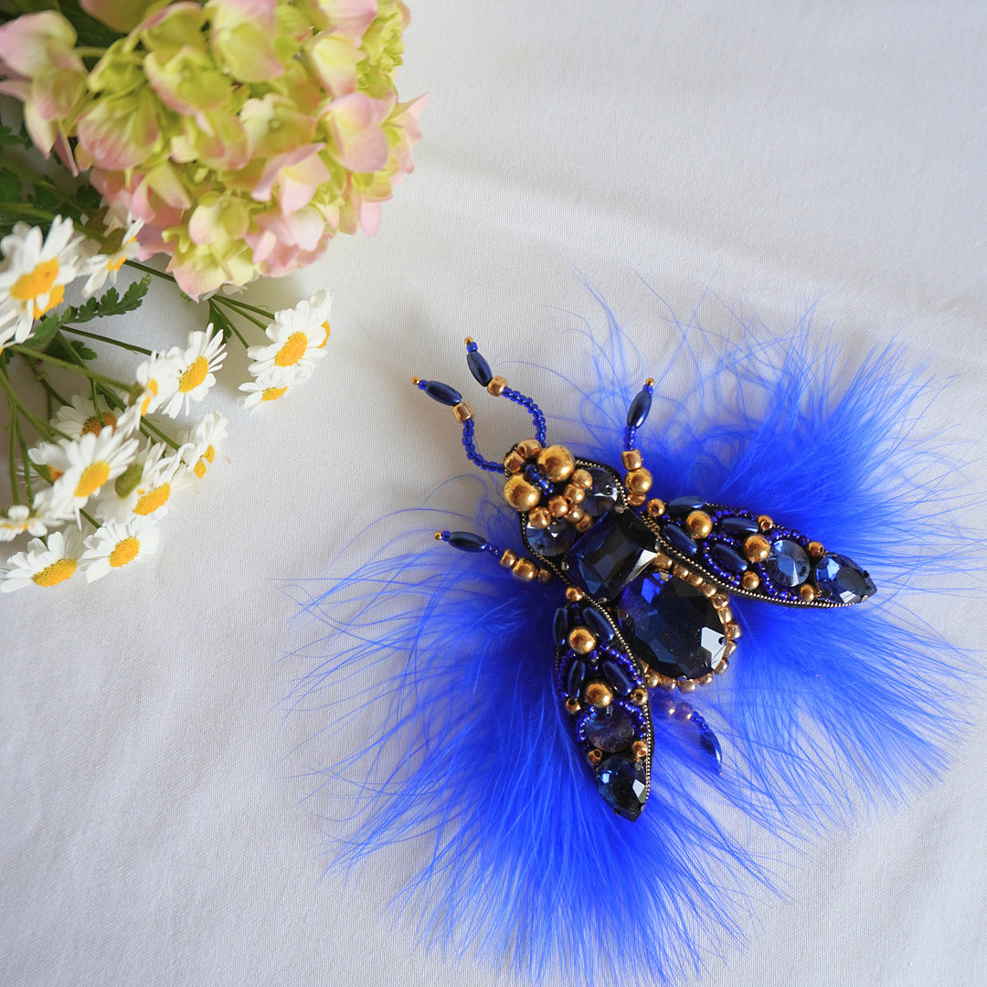 Handmade embroidered fly TGbrooch in electric blue and gold color combination