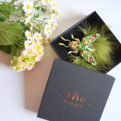 Handmade beaded olive green and gold insect brooch in a black box - TGbrooch