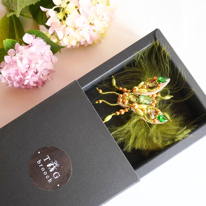 Lovely beaded TGbrooch in olive green and gold color combination in a box