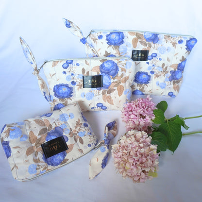 Set of handmade quilted toilerty bags with floral blue roses pattern print designed by TGbrooch